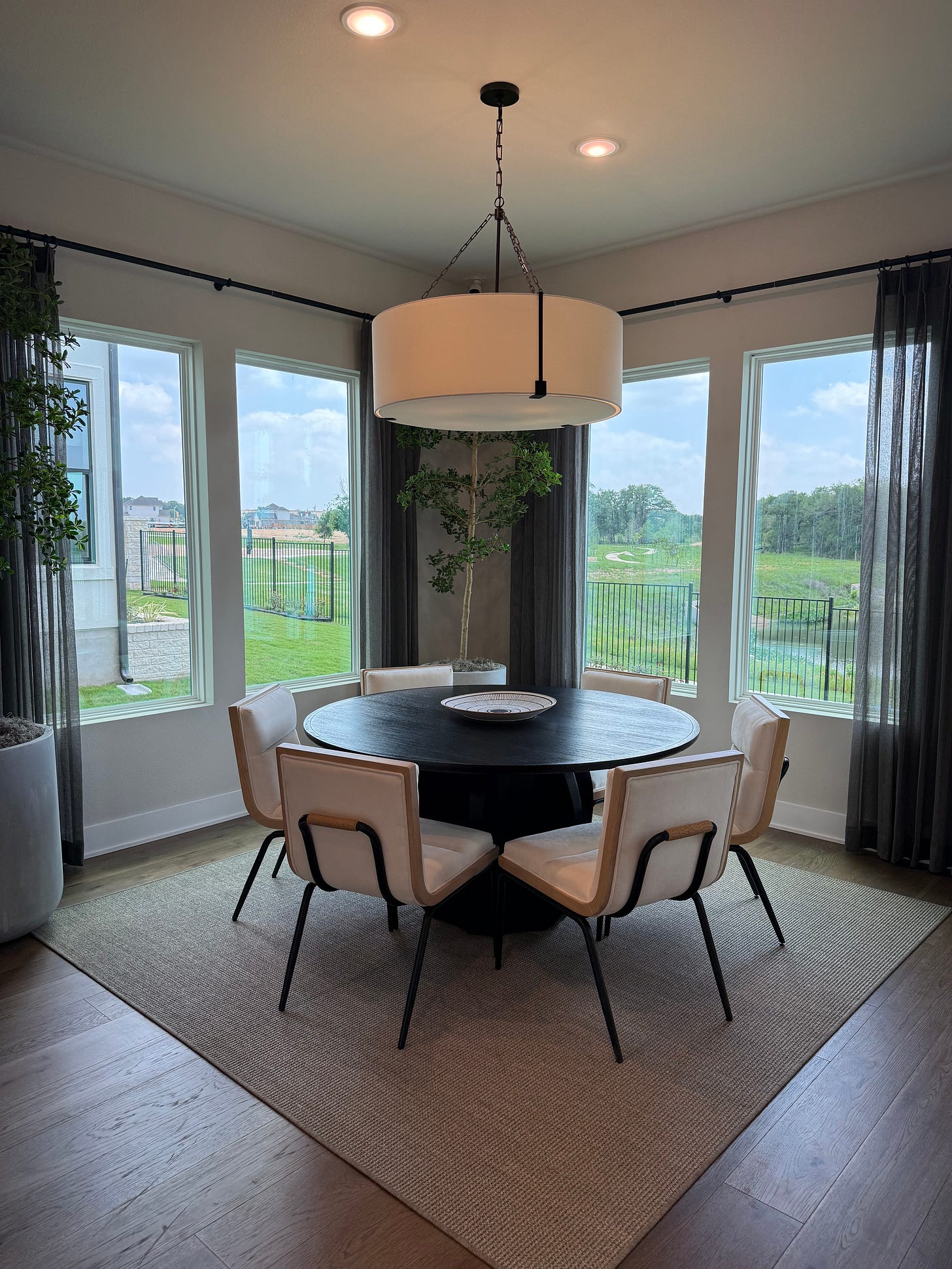 Clean, bright Central Texas living room staged with neutral décor, natural light, and open sightlines.