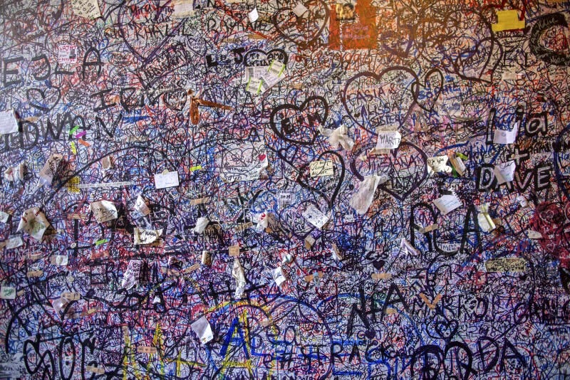 Graffiti on the Brick Vole Juliet`s House in Verona. Wall Covered with ... Graffiti on the Brick Vole Juliet`s House in Verona. Wall Covered with ...
