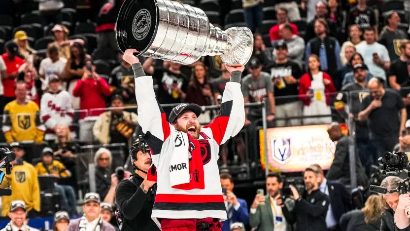 Hurricanes defenseman Jaccob Slavin lifts the Stanley Cup