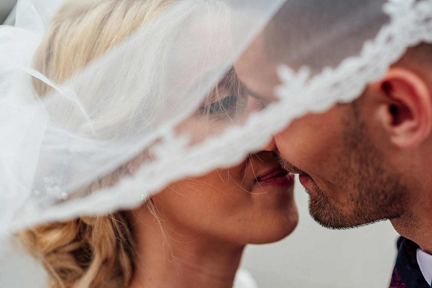 Bride and groom kissing at a wedding