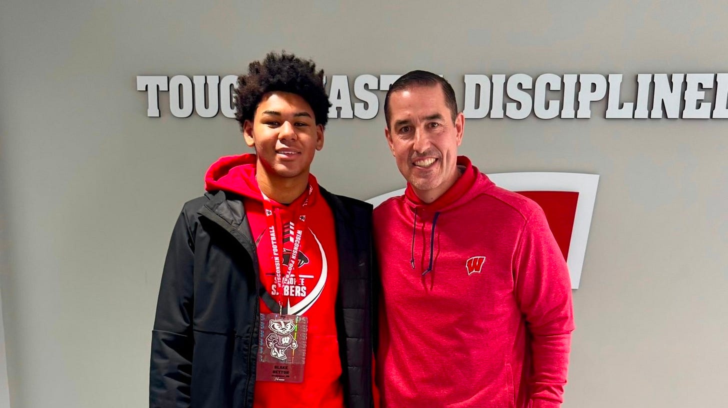 Blake Betton stands with Wisconsin head coach Luke Fickell during a recruiting visit.