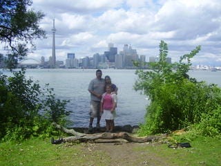 In the first image my sister Abigail, Annabelle, and I are posed on Centre Island with the Toronto skyline circa 2005 is in the background. The second photo is of the old Maple Leaf Gardens, and the final photo is of a upper middle aged balding man, my father.