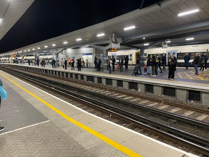 A variety of pictures of London Bridge station. Some are pictures of platforms with people waiting for trains. One is of the Shard with the platforms and train below it. Two are of the main hall under the platforms