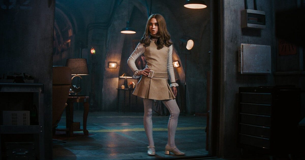 M3GAN standing hand on hip in her new underground lair. M3GAN standing hand on hip in her new underground lair.