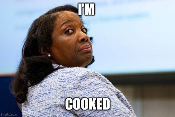 Lisa Cook, a woman with long dark hair wearing a blue and white patterned sweater, looking over her shoulder with a concerned expression. Text overlay reads "I\'M COOKED" in bold white letters.