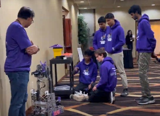 Students presenting robots at the PNSQC STEM Fair Students presenting robots at the PNSQC STEM Fair