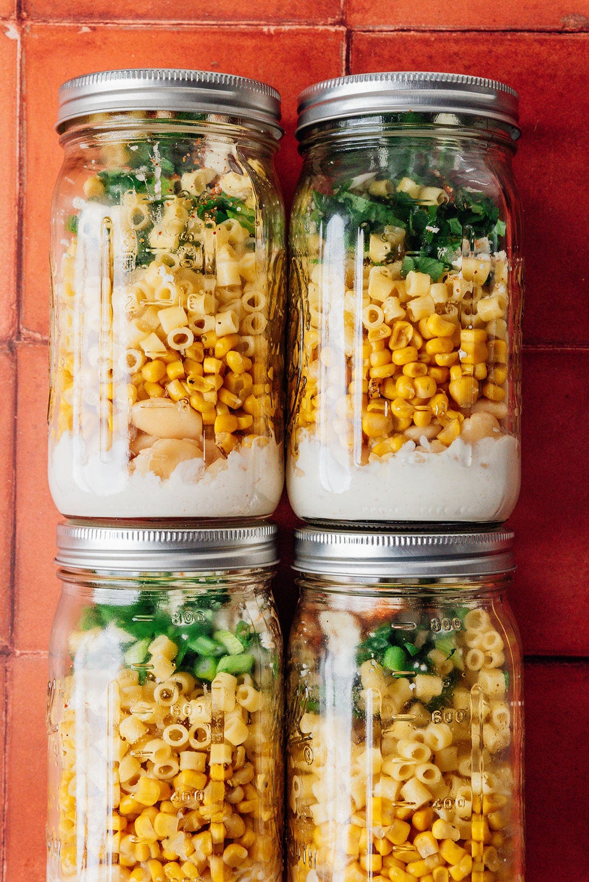 Street corn pasta salad in jars.