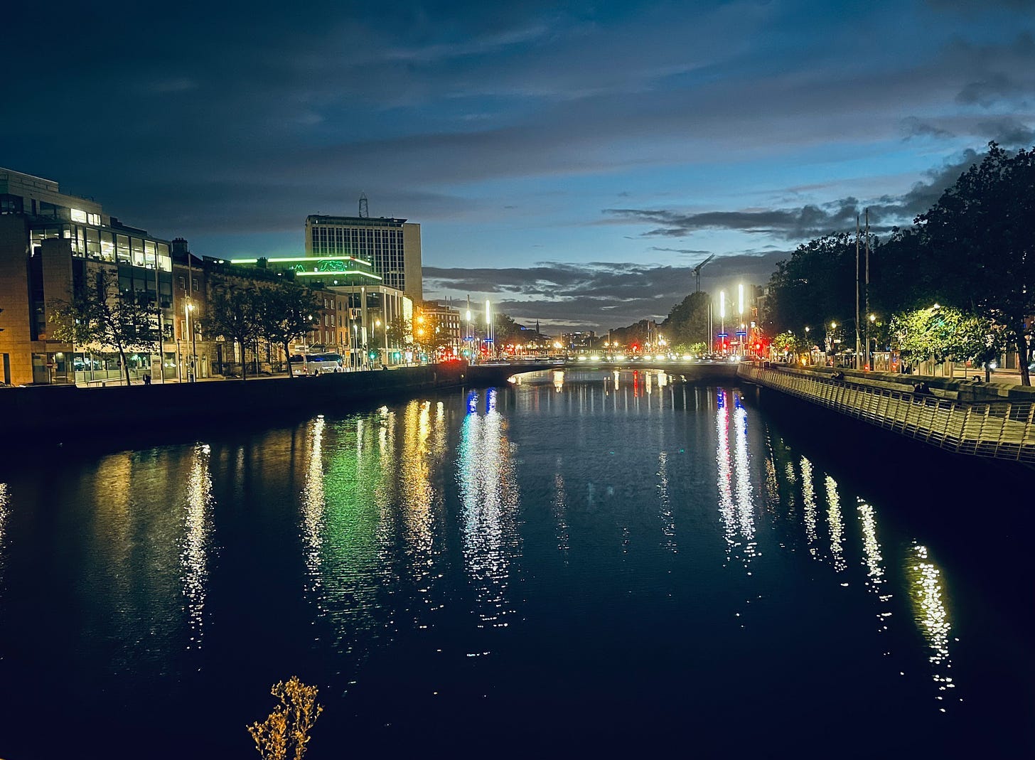 A river with lights on it

Description automatically generated