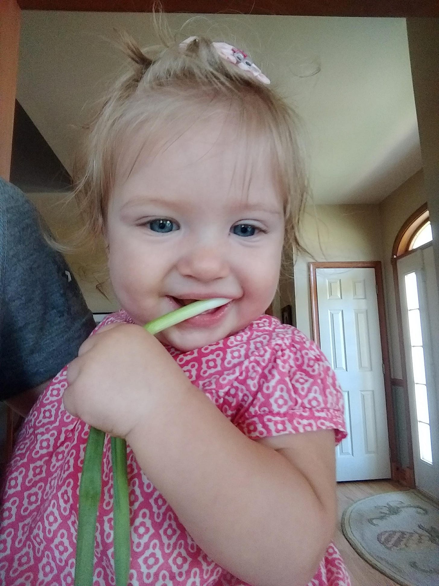  Maria teething on a scallion! 