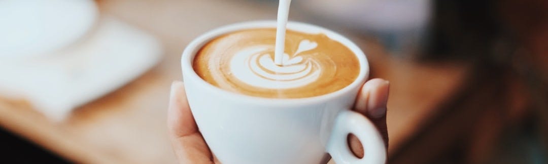 person making latte art