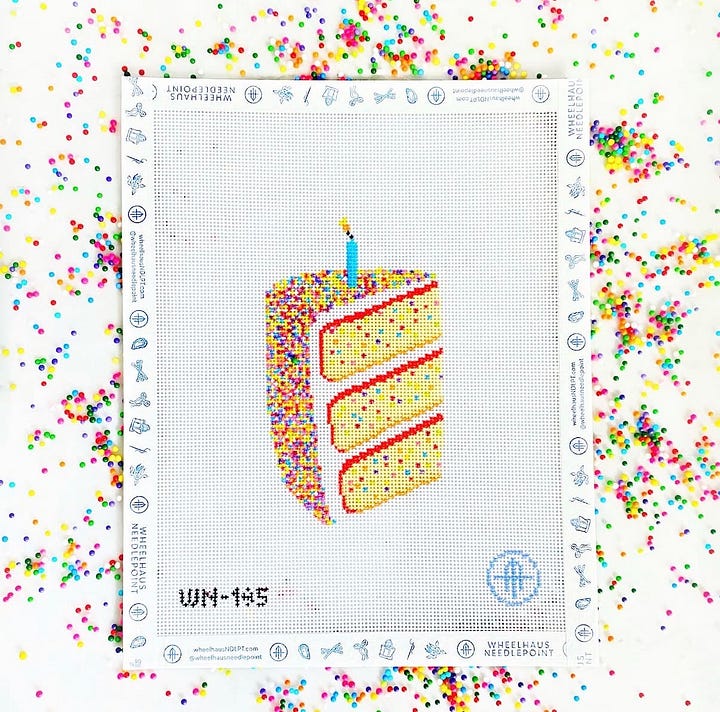 needlepoint canvases of boat and tote, sour dough starter, slice of cake and butterfly clips