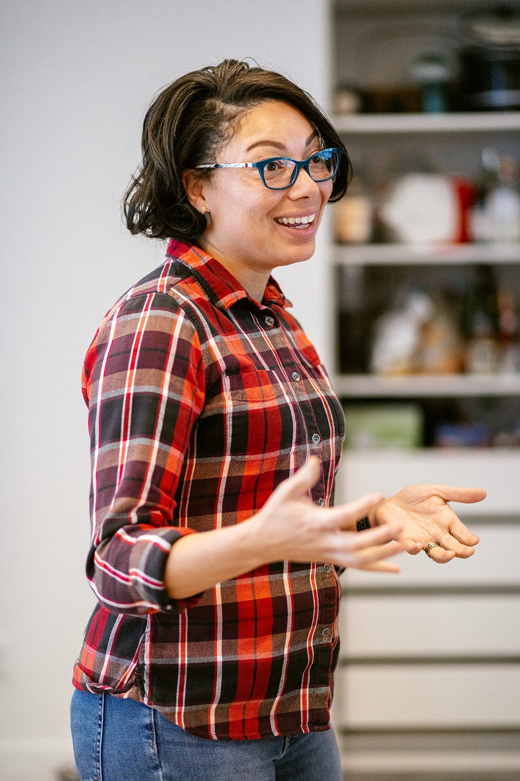 Image of Löki Gale Tobin wearing blue glasses and a red flannel shirt