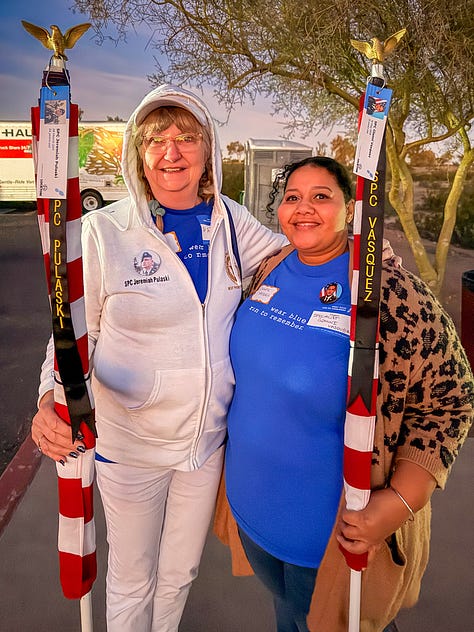 Two women, mothers of fallen soldiers, stand side-by side, holding American flags that represent their fallen sons. An image gallery from that morning shows pictures of fallen soldiers, runners along the Papago Park trail and a beautiful desert morning.