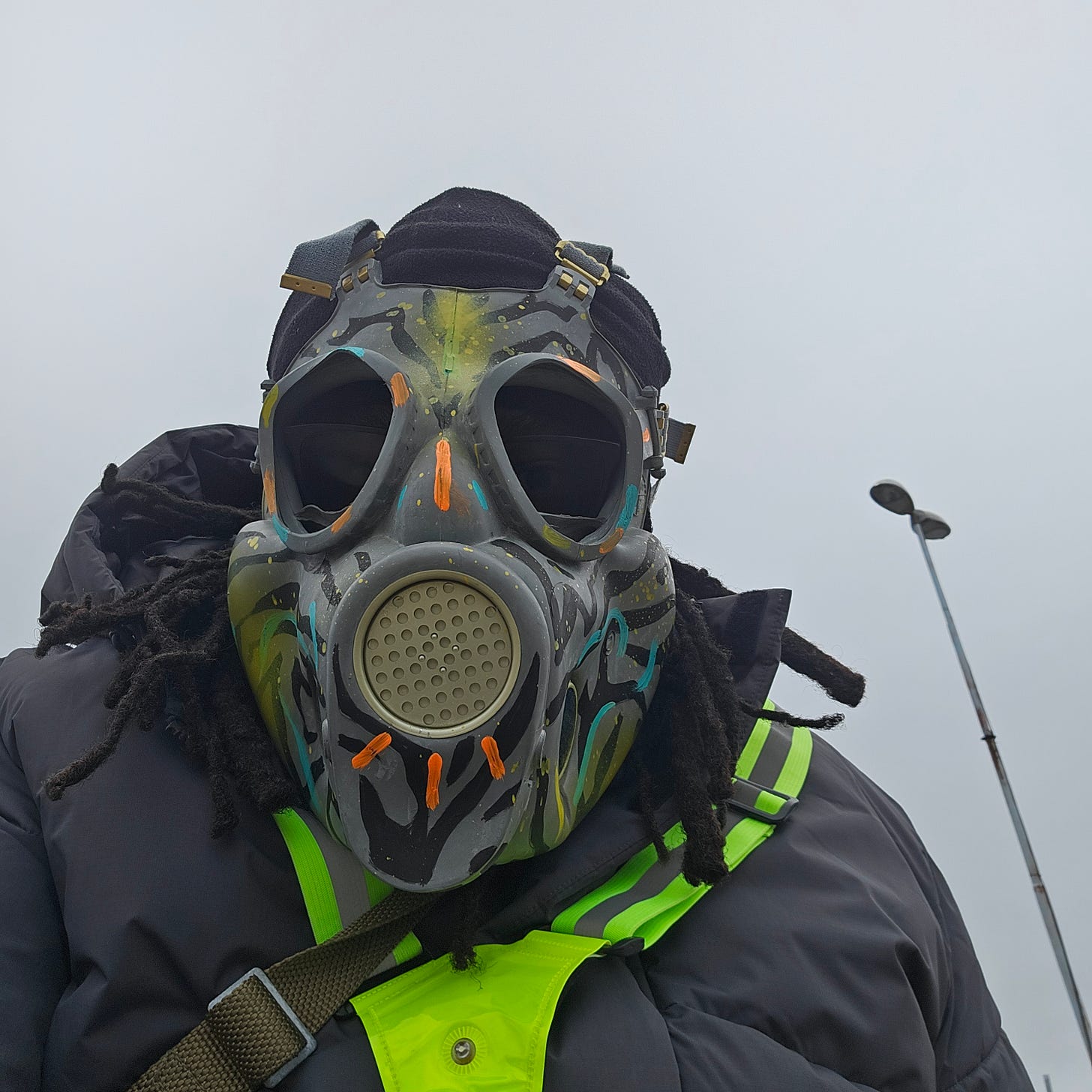 FatbikeHero wearing graffiti painted Gas Mask [painted by Bhukie]  as part of Performance Art in Aarhus.