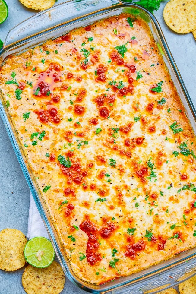 Cheesy baked Mexican corn dip in a casserole dish. Cheesy baked Mexican corn dip in a casserole dish.