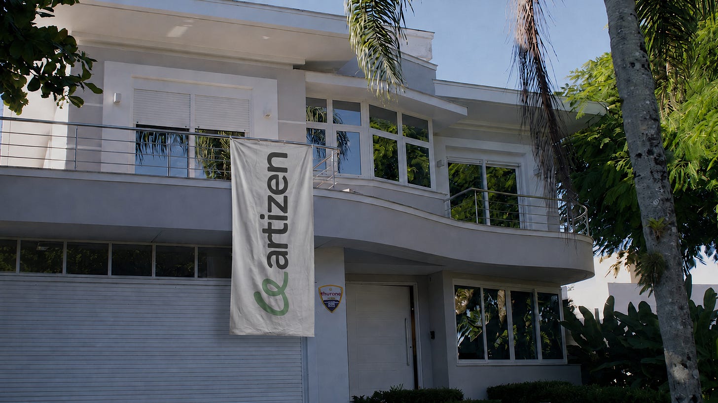 White house with an Artizen banner, the sponsored residency at Ipê Village White house with an Artizen banner, the sponsored residency at Ipê Village