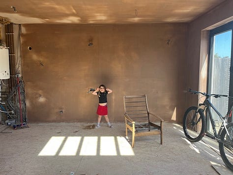 plastered walls; pitched roof; exposed roof beams; underfloor heating; cork flooring; pocket sliding doors