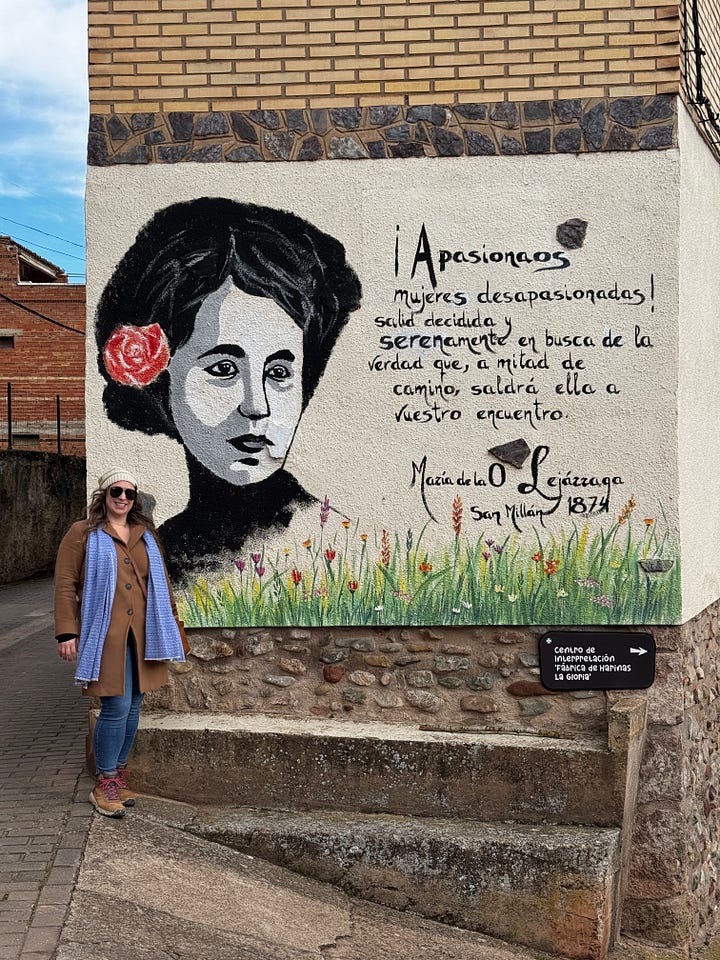 A mural with a quote from María and a plaque on the house she was born in.