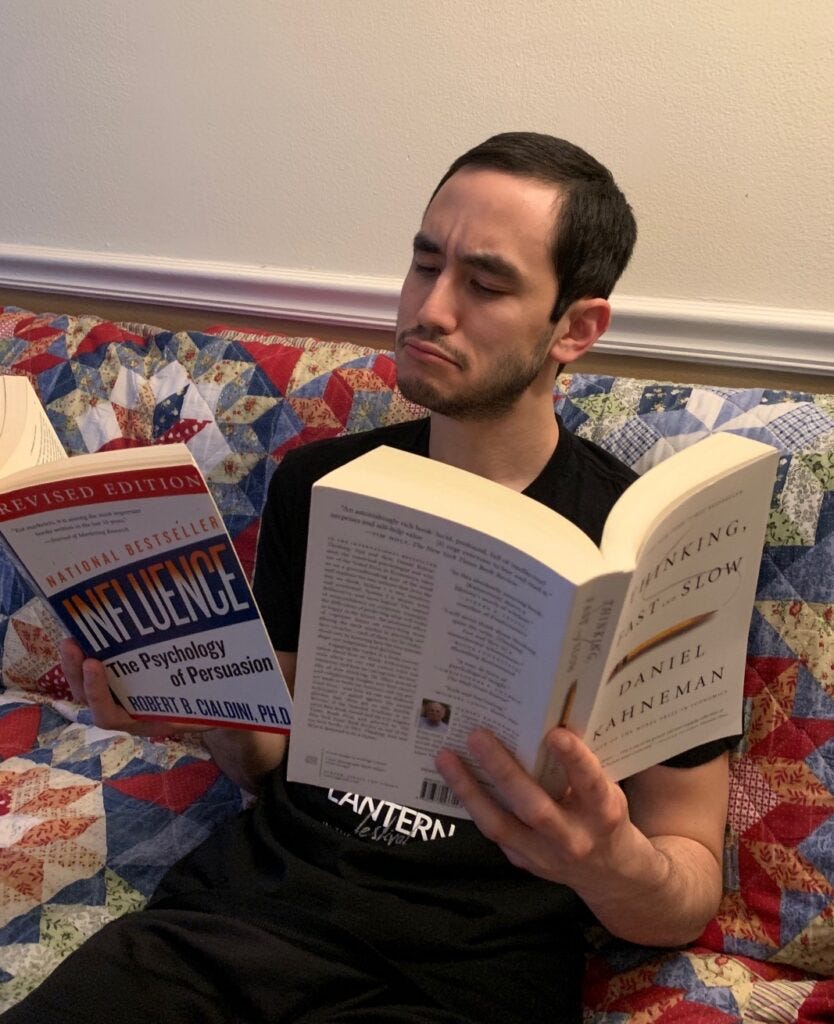 The author reading two books