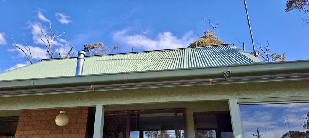 Sprinklers along the roof ridge and below the guttering. 