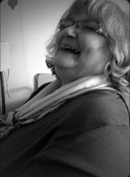 Mom with her head back laughing.