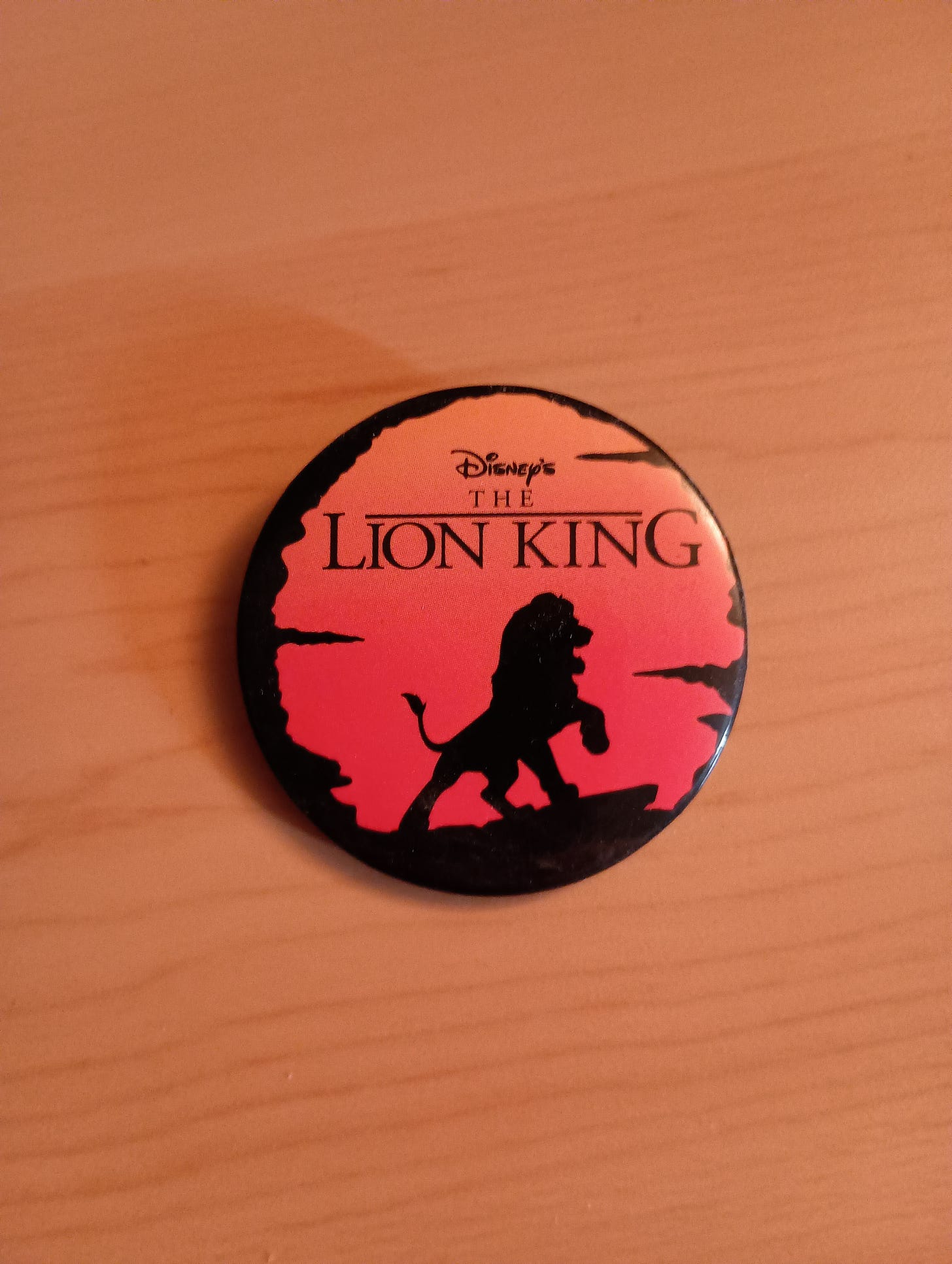 Disney's The Lion King with a silhouette of the lion Disney's The Lion King with a silhouette of the lion