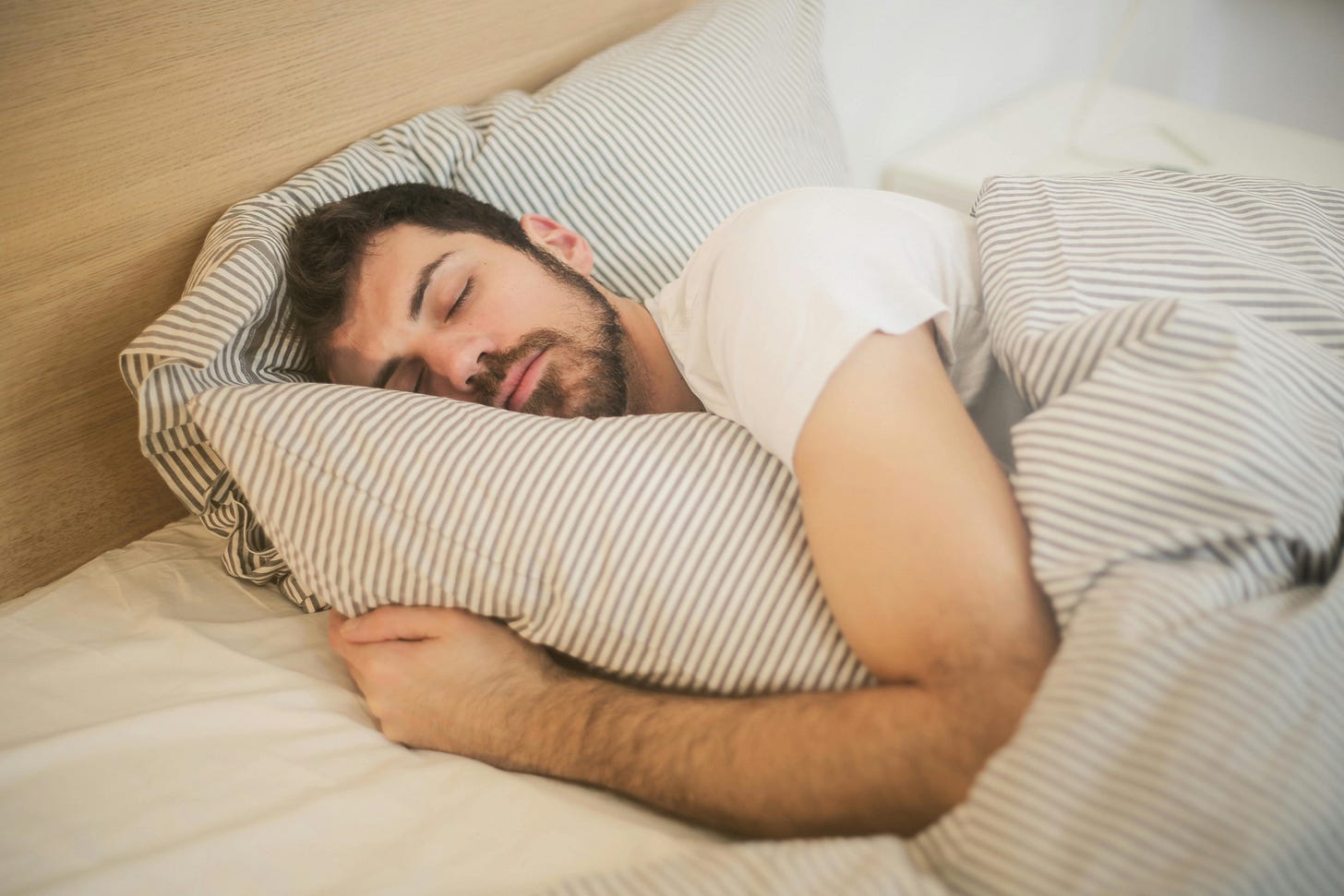 Relaxed state of a person promoting preventive healthcare through good sleep.