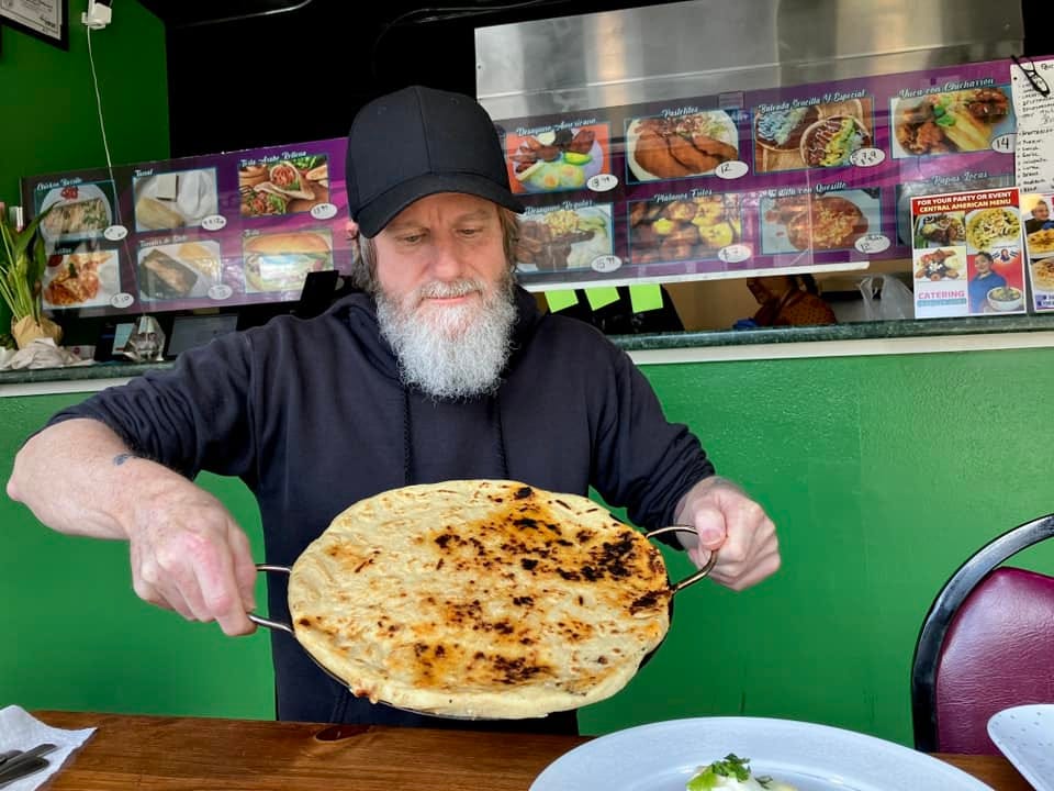 May be an image of 1 person, gyro and burrito
