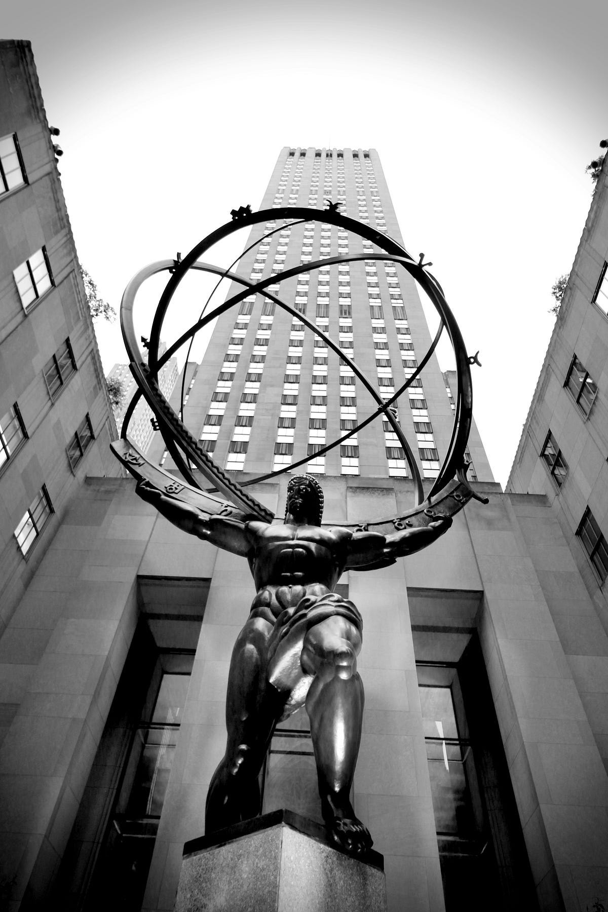 Atlas, a bronze statue in Rockefeller Center, within the International Building’s courtyard, Midtown Manhattan in New York City. It is across Fifth Avenue from St. Patrick’s Cathedral. — source wikipedia Atlas, a bronze statue in Rockefeller Center, within the International Building’s courtyard, Midtown Manhattan in New York City. It is across Fifth Avenue from St. Patrick’s Cathedral. — source wikipedia