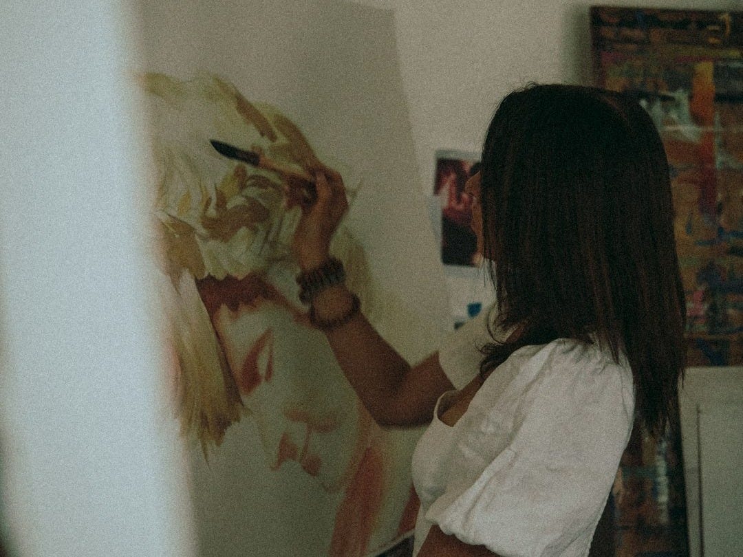 woman in white shirt painting woman in white shirt painting