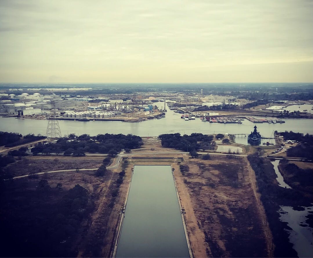 View of industrial landscape around coastal waterway View of industrial landscape around coastal waterway
