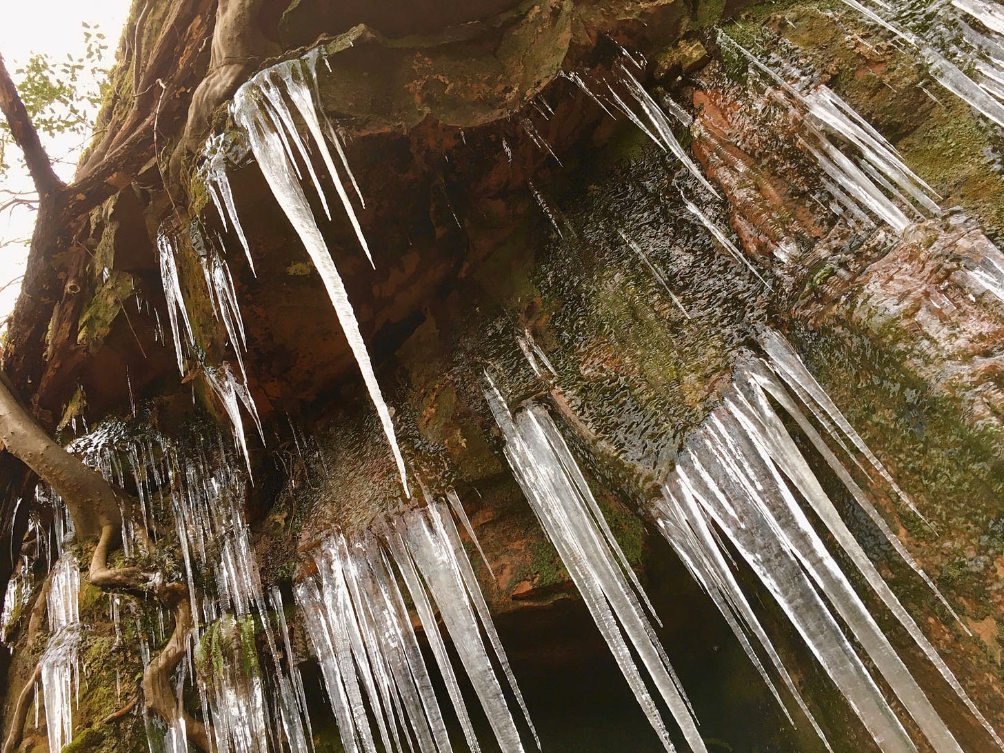 icicles on red sandstone rock