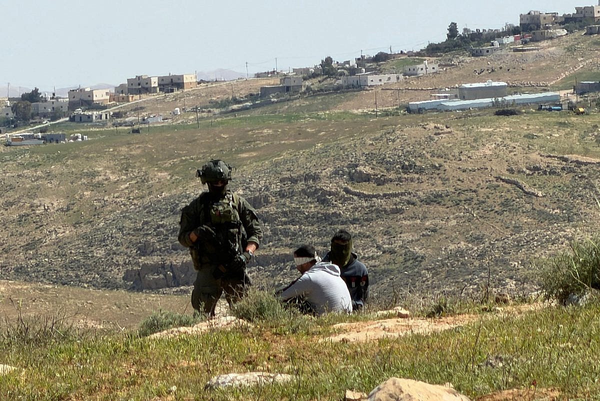 Israeli soldiers arrest Palestinian shepherds in the village of Rujum ‘Ulya, Masafer Yatta, West Bank, March 25, 2026. (Basel Adra)