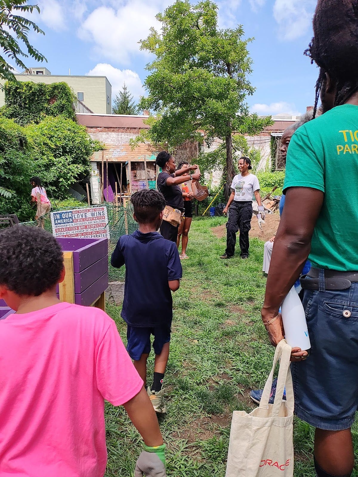 Neighbors of all ages talking and exploring Pentridge Children’s Garden.
