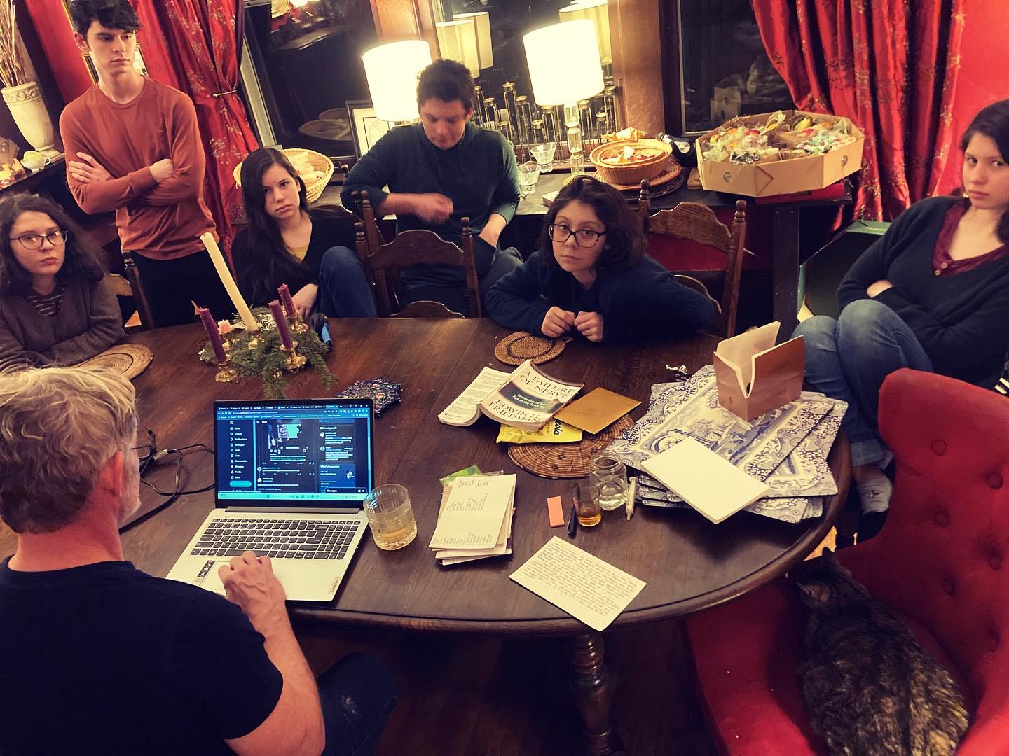 May be an image of 7 people, people studying, table and text