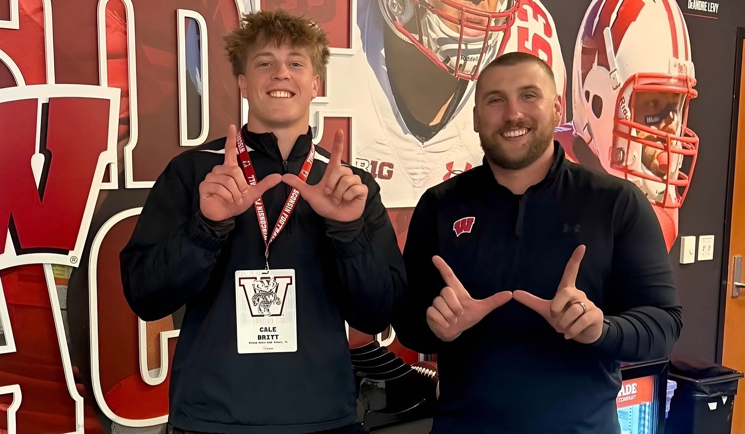 Wisconsin linebacker commit Cale Britt stands with inside linebackers coach Tuf Borland during a recruiting visit. Wisconsin linebacker commit Cale Britt stands with inside linebackers coach Tuf Borland during a recruiting visit.
