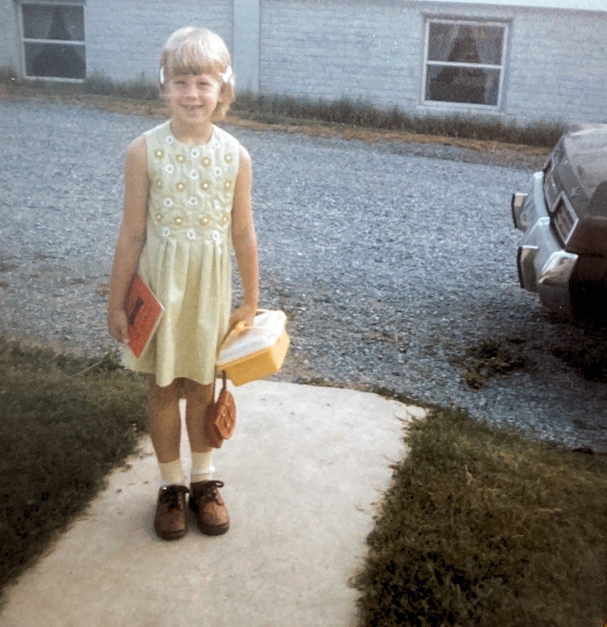 starting first grade with lunch box and ugly shoes