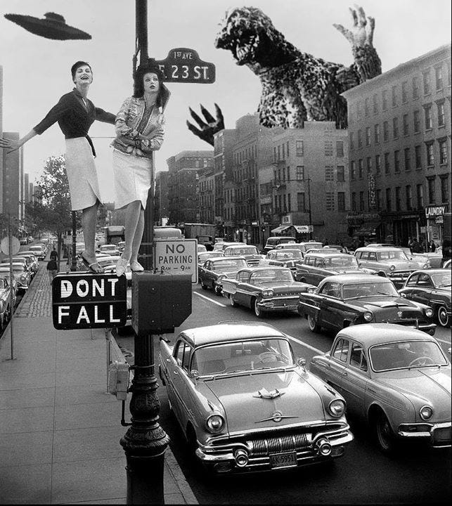 This may contain: black and white photograph of two women standing on a street sign with cars in the background