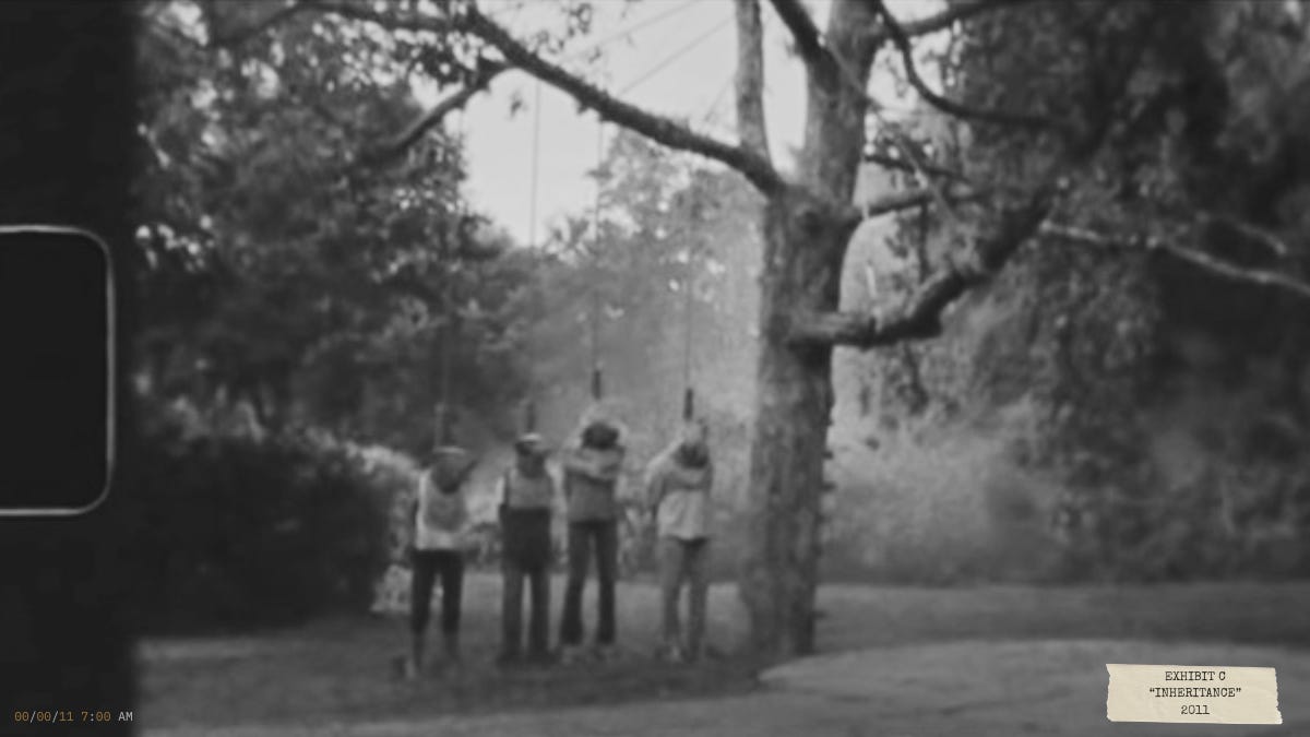 Black-and-white still from Sinister (2012) depicting a family hanging from a tree, referencing the discovered Super 8 snuff film central to the investigation.