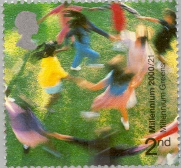 A stamp showing a group of people dancing in a circle over a green background, their movement smudging their lines together A stamp showing a group of people dancing in a circle over a green background, their movement smudging their lines together
