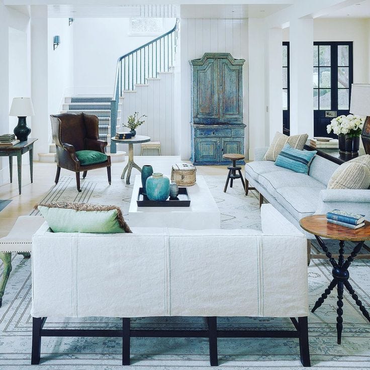 This may contain: the living room is clean and ready for guests to use it as a focal point