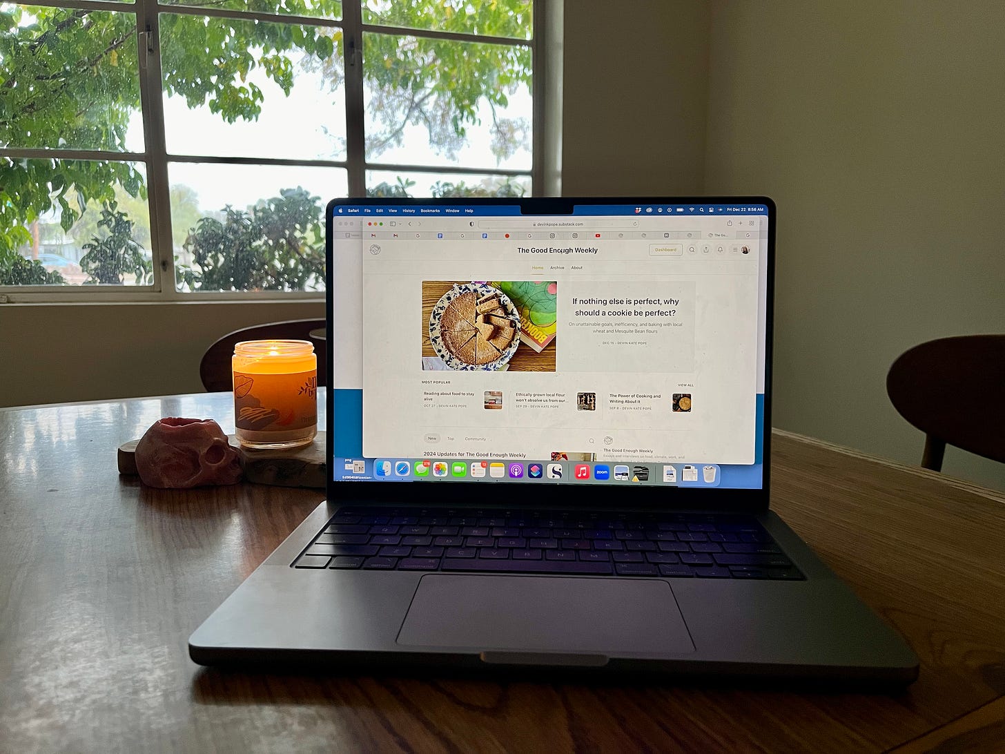My kitchen table with my laptop open to the home page of this newsletter