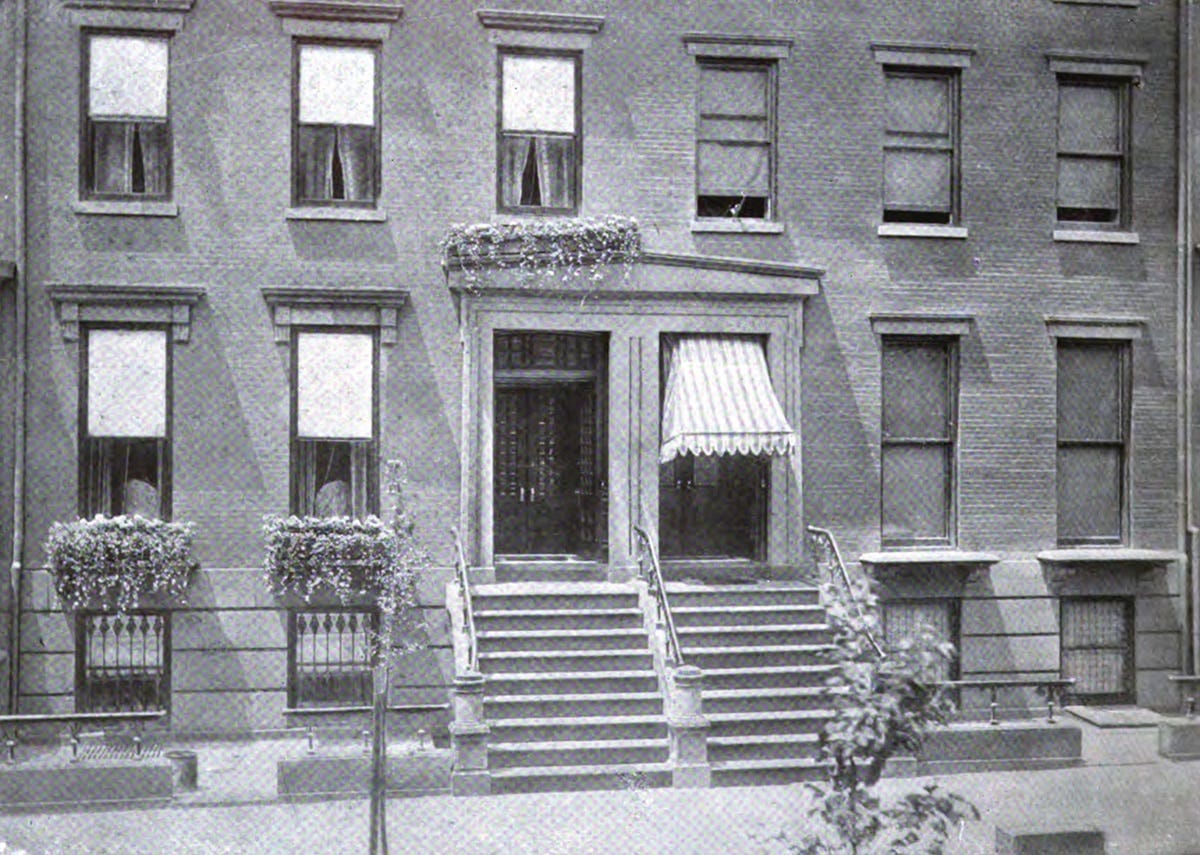 black and white photo showing a house with window boxes and one without black and white photo showing a house with window boxes and one without