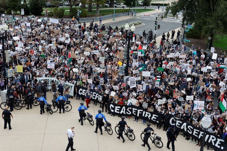 A crowd of demonstrators calling for a cease fire in Gaza and an end to the Israel-Hamas conflict are kept back by US Capitol police officers as other officers detain protestors holding a civil disobedience action inside the Cannon House office building on Capitol Hill in Washington, US, October 18, 2023 A crowd of demonstrators calling for a cease fire in Gaza and an end to the Israel-Hamas conflict are kept back by US Capitol police officers as other officers detain protestors holding a civil disobedience action inside the Cannon House office building on Capitol Hill in Washington, US, October 18, 2023