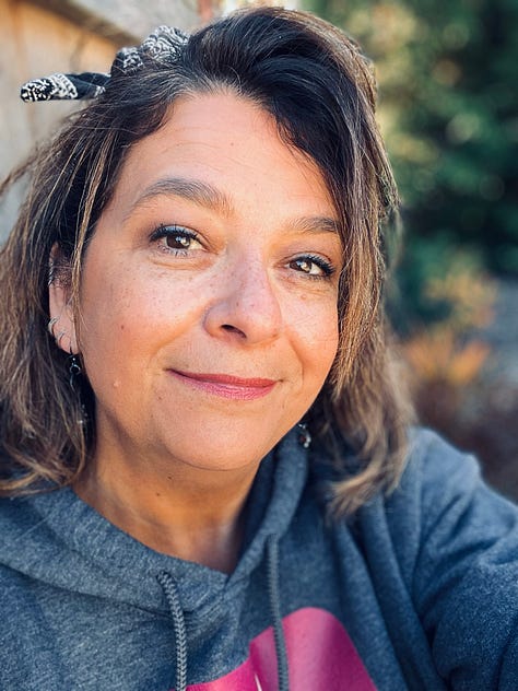 a woman with short brown hair tied with a bandanna, a short story book, Cut De Sac Stories, and a poetry volume, Intention Tremors