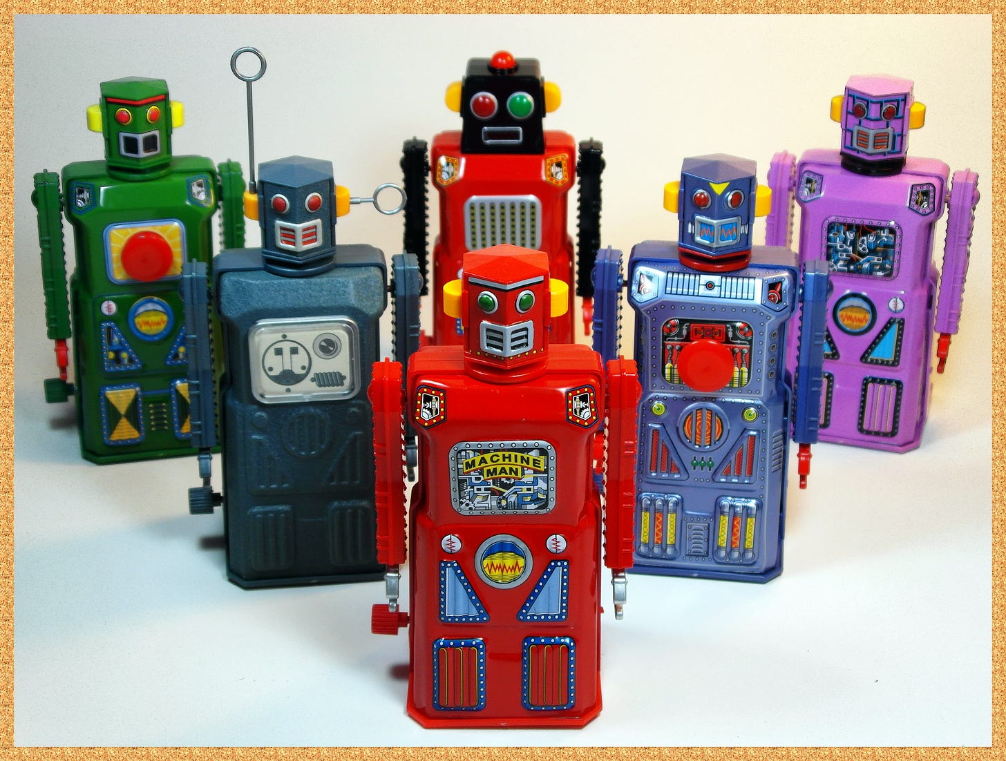Six vintage toy robots standing together. Six vintage toy robots standing together.