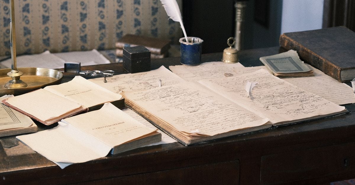 Photo: Михаил Крамор / Pexels Cozy study with vintage desk, open books, and quill for a classic literary feel.