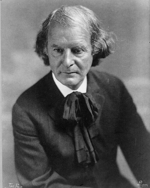 Portrait of Elbert Hubbard, shown from the chest up, in formal early-20th-century attire.