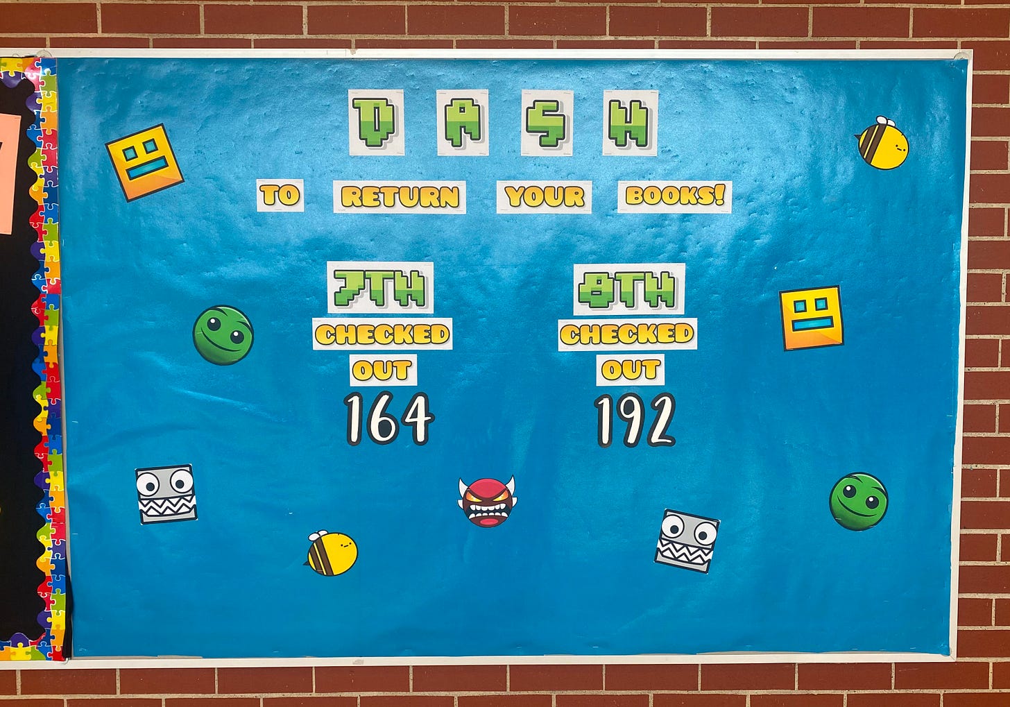 A bulletin board that says "dash to return your books" in Geometry Dash themed font.