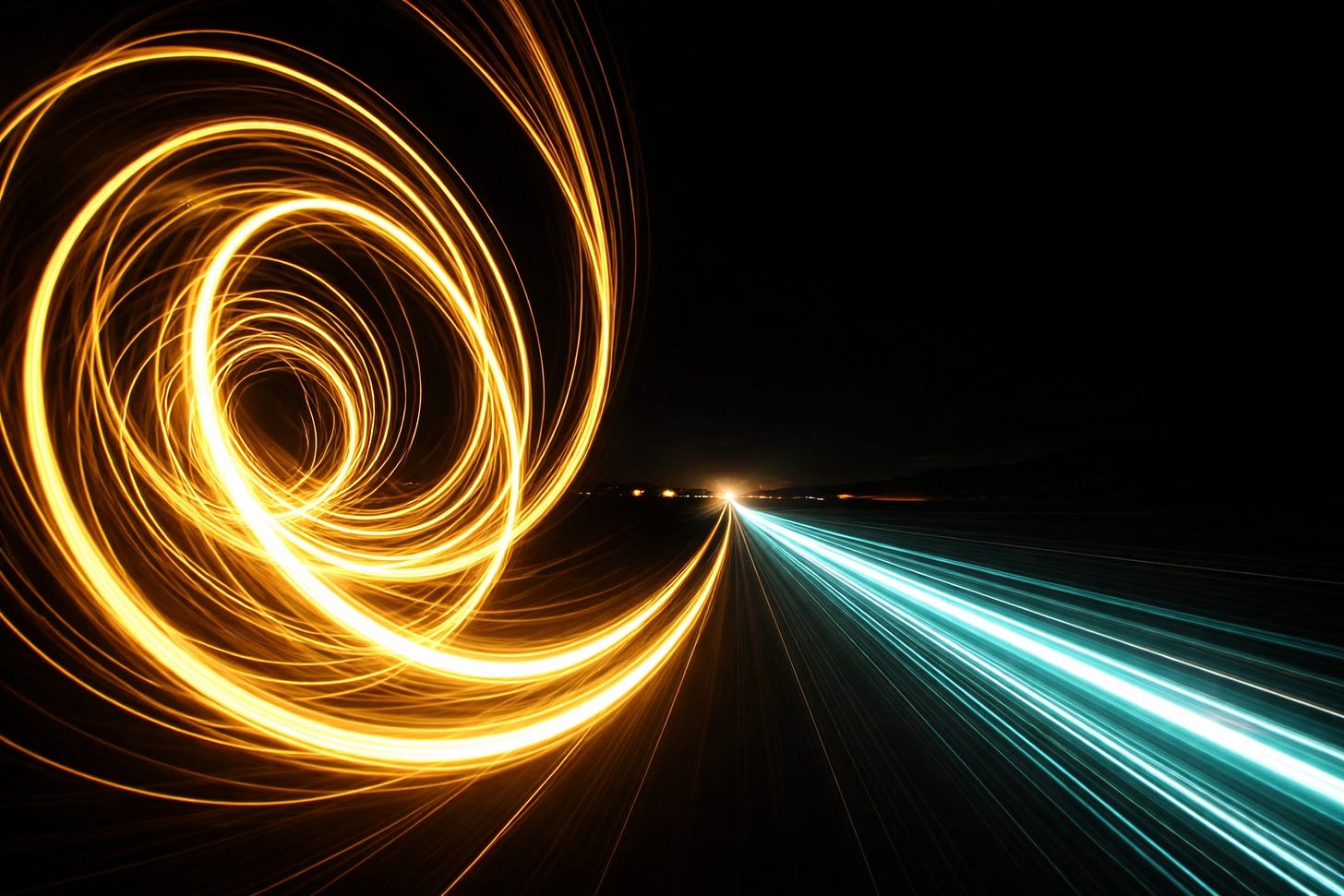 Swirling yellow light and a line of brilliant teal light